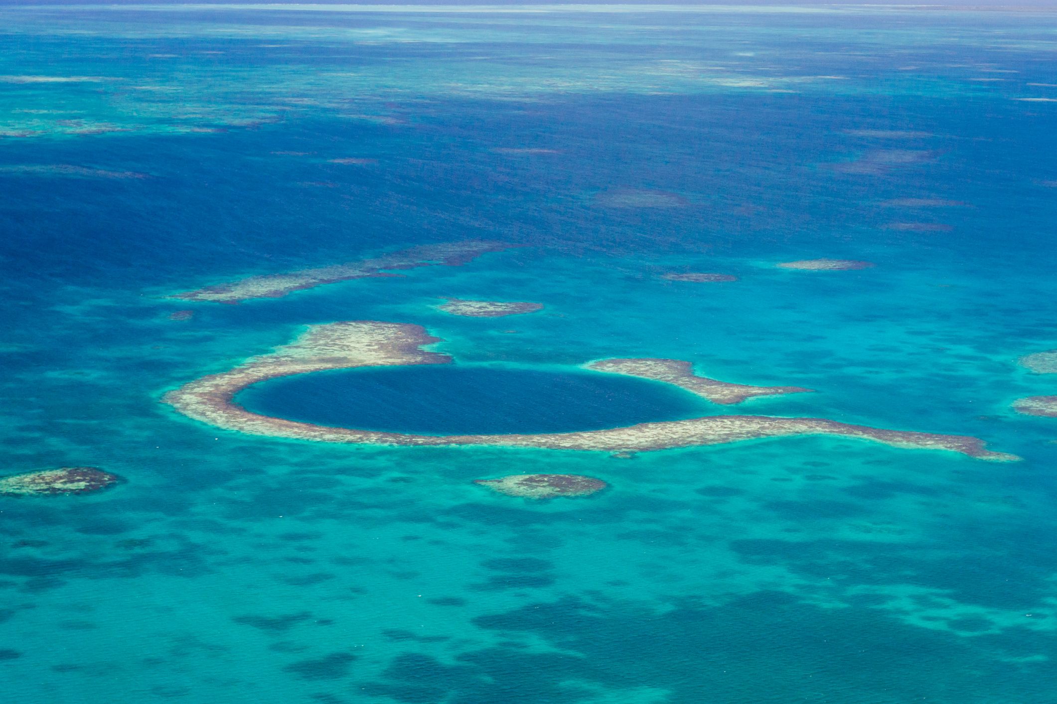Aerial view of the great blue hole of the coast of Belize 