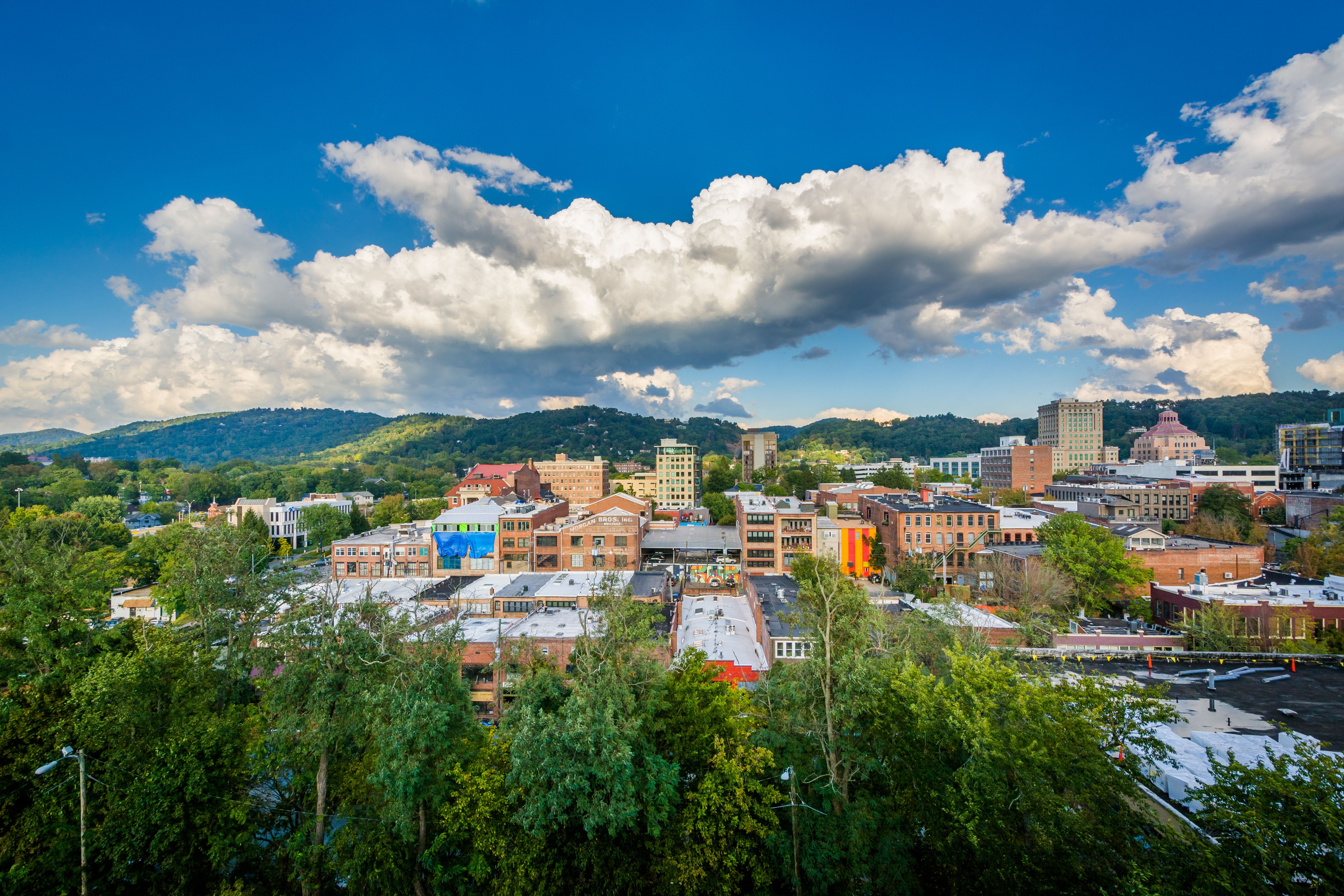 Downtown Asheville with buildings and surrounding mountains