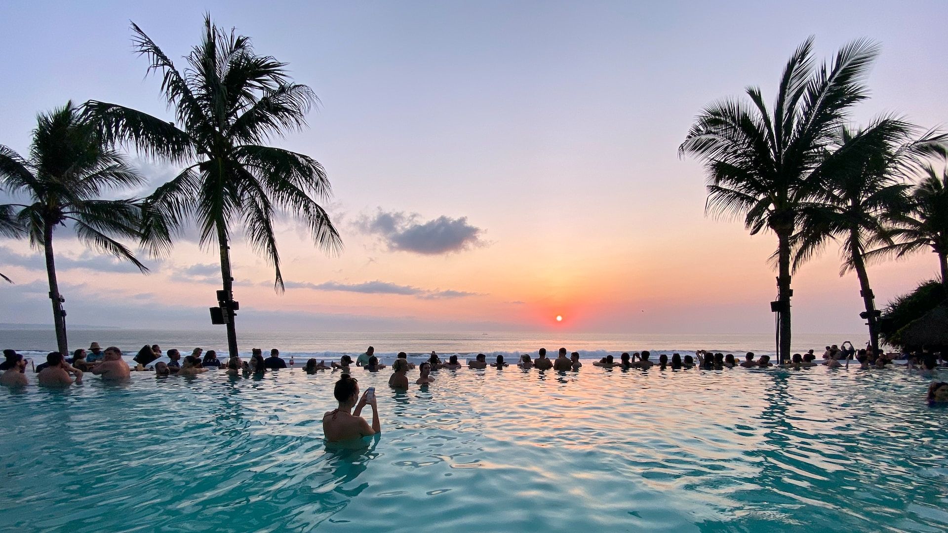Sunset at a pool at a hotel in Seminyak Beach, Bali, Indonesia 