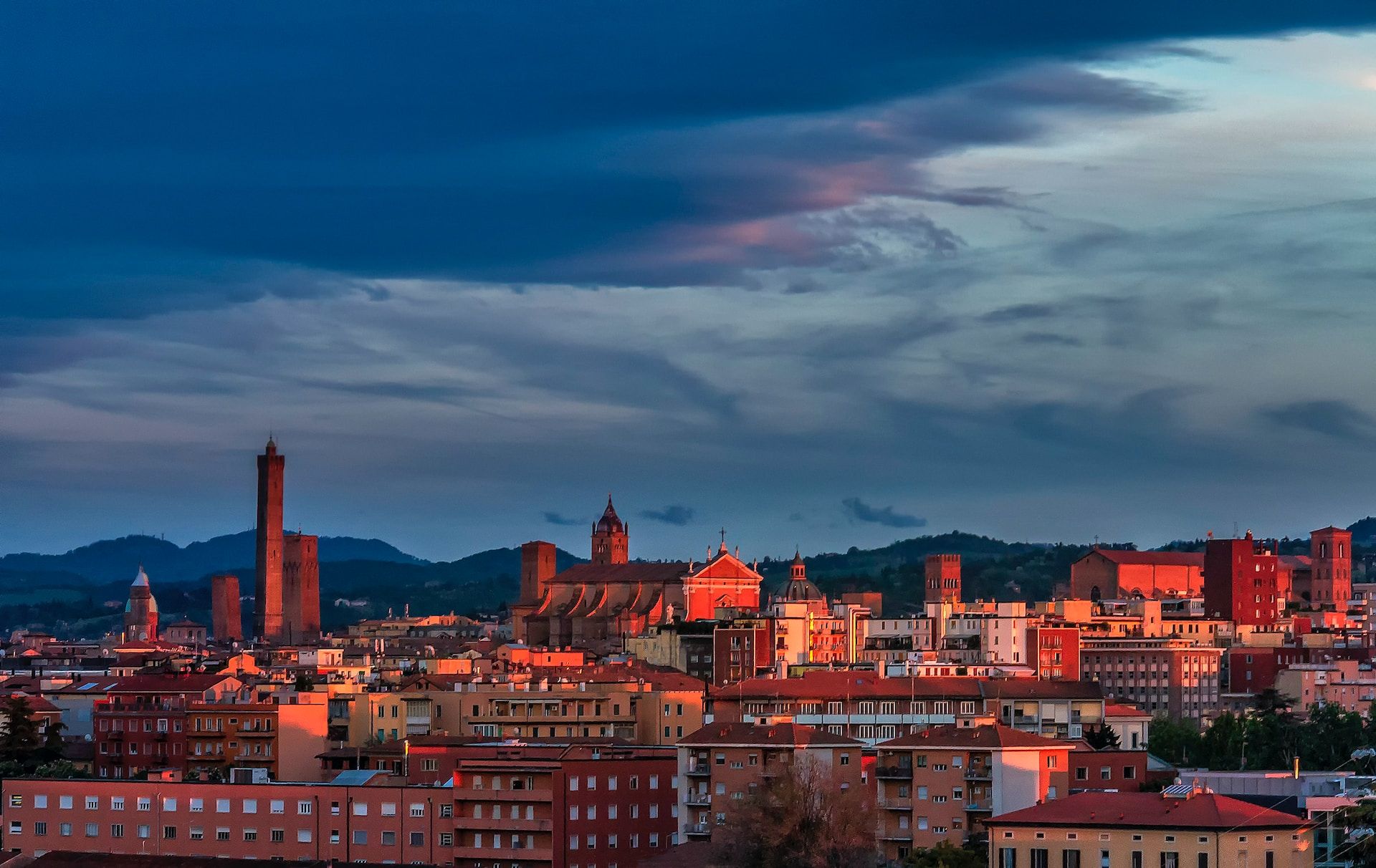 Bologna, Italy begins to light up in the evening