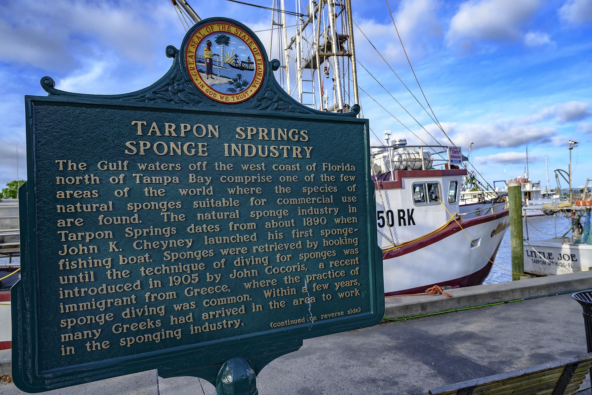 A sign documenting history at Tarpon Springs dock in Florida