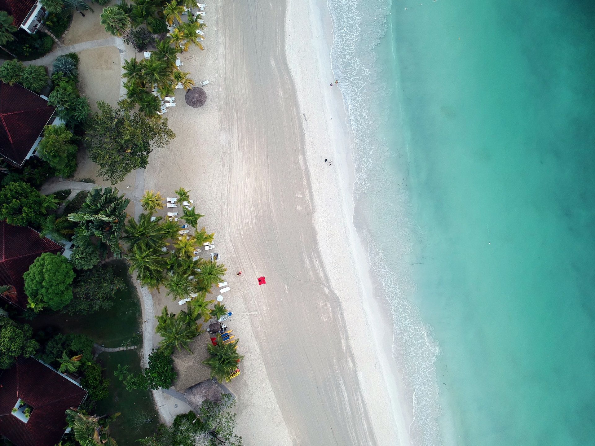An aerial view of a beautiful white sand beach in Negril, Jamaica