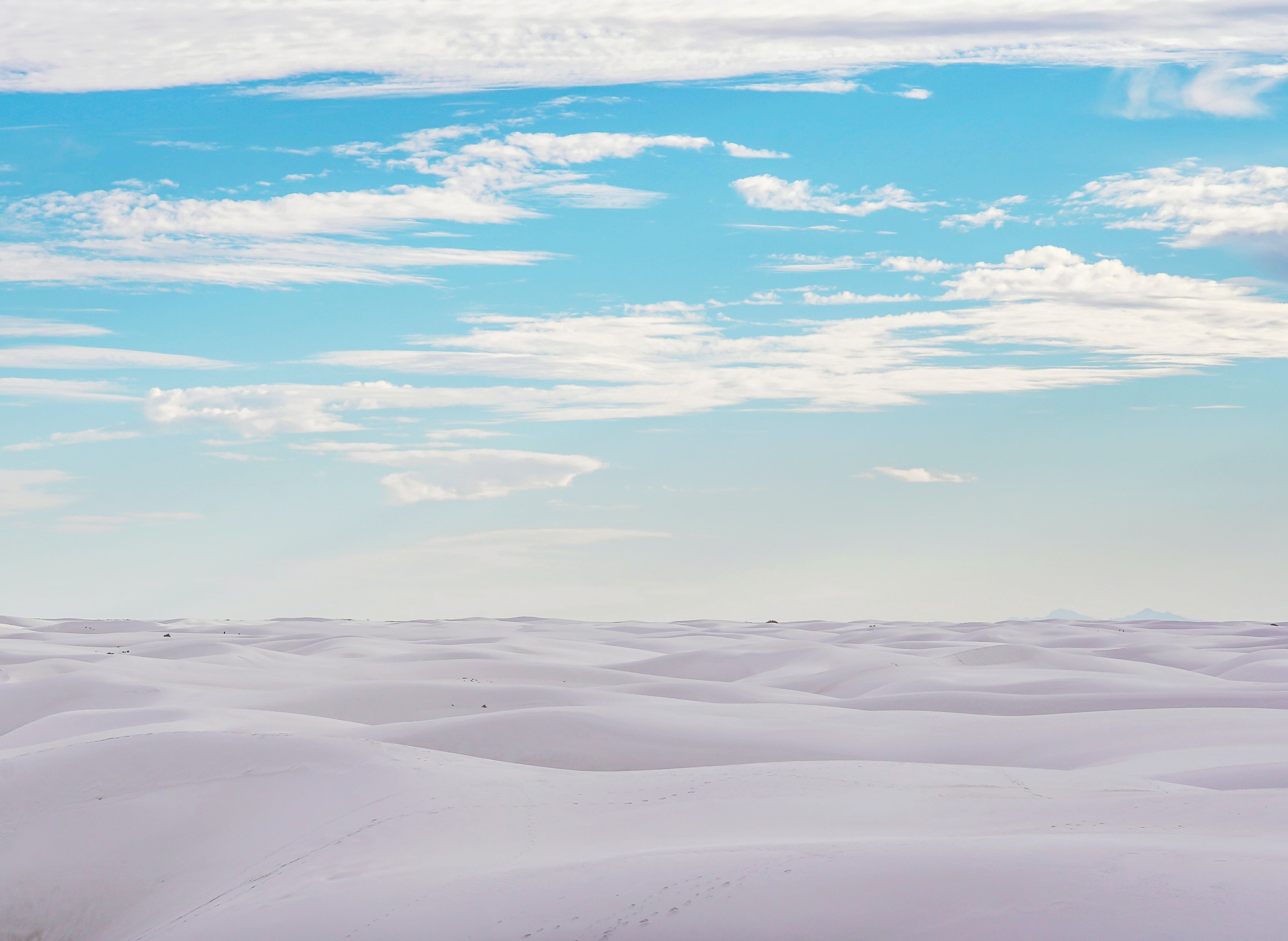 White sands under a bright blue sky in White Sands National Park