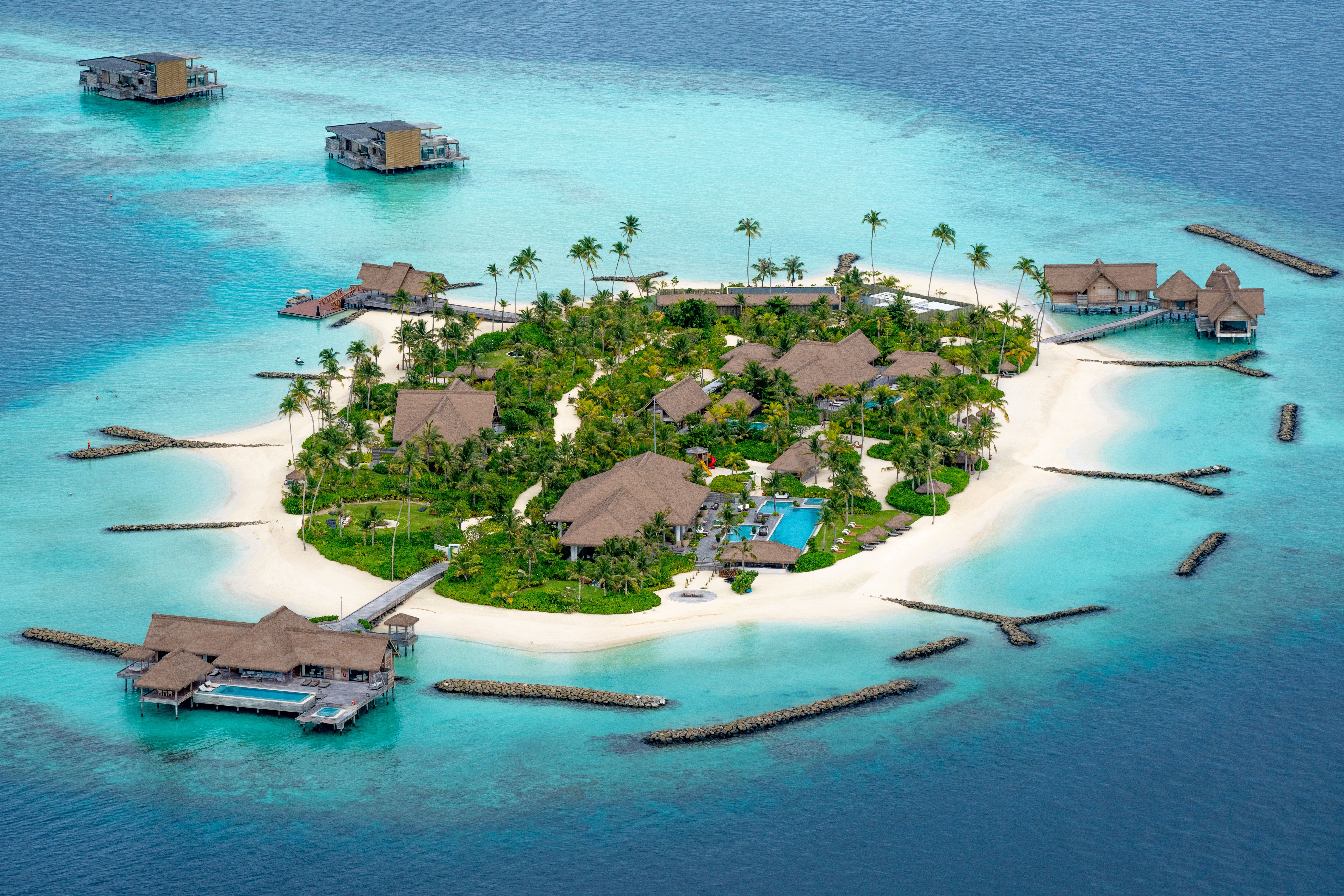 A resort on an island in the middle of a water body in the Maldives