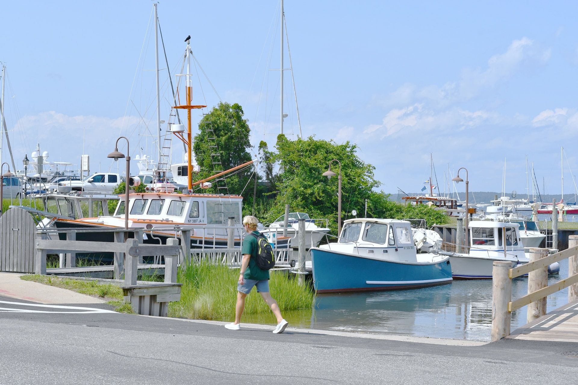 A man walking along the Sag Harbor, Long Island, New York, USA