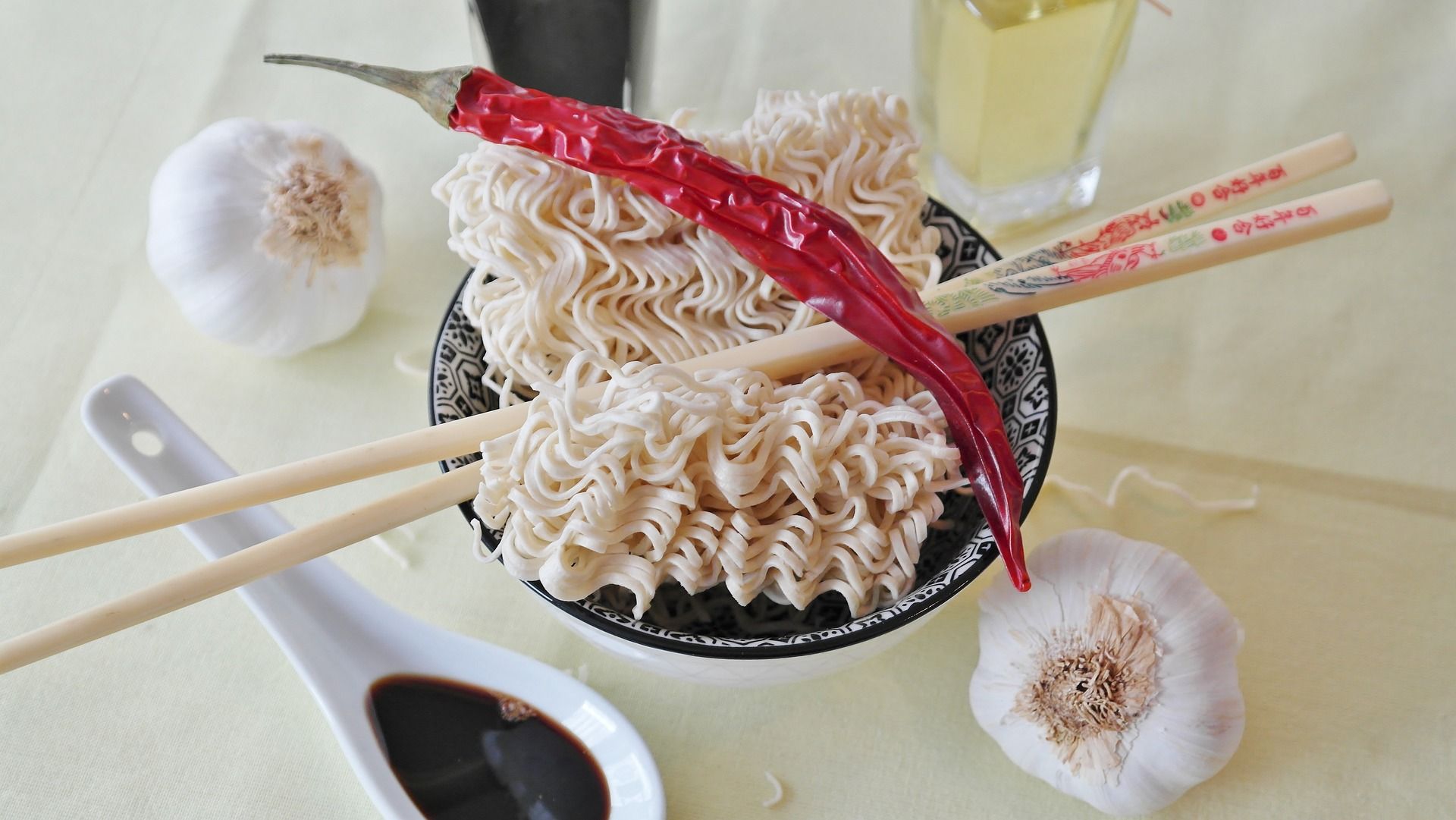 A bowl of noodles with Japanese chopsticks