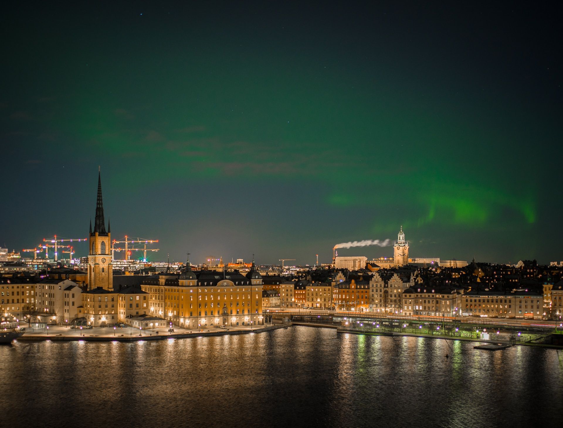 Sweden's capital city illuminated by the northern lights, a rather rare occurence in the area.