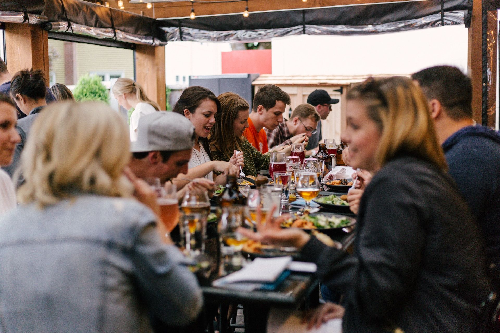 Diners eating a meal around a restaurant table