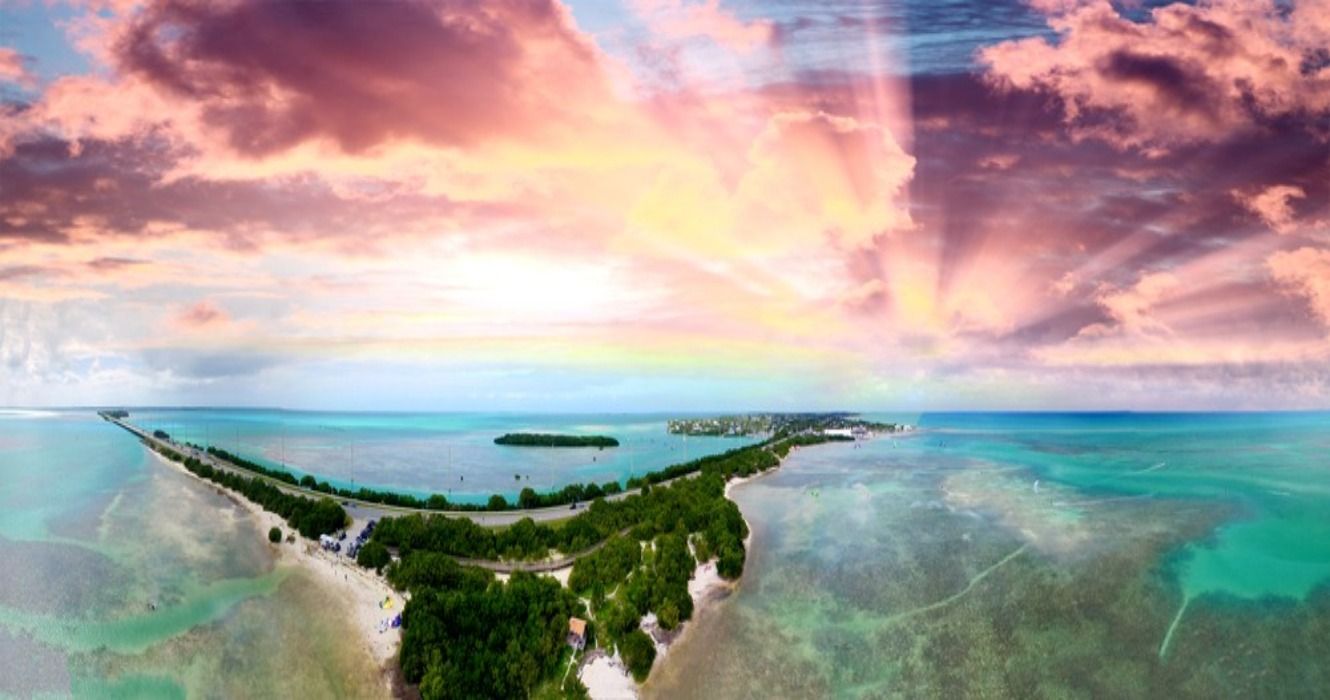 Overseas Highway and Florida Keys coastline, an aerial sunset view.