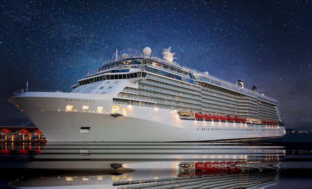 A cruise ship docked at night