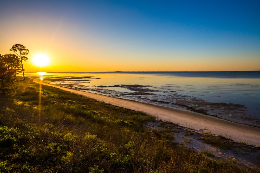 Magical sunrise on a beach in Apalachicola, Florida, USA
