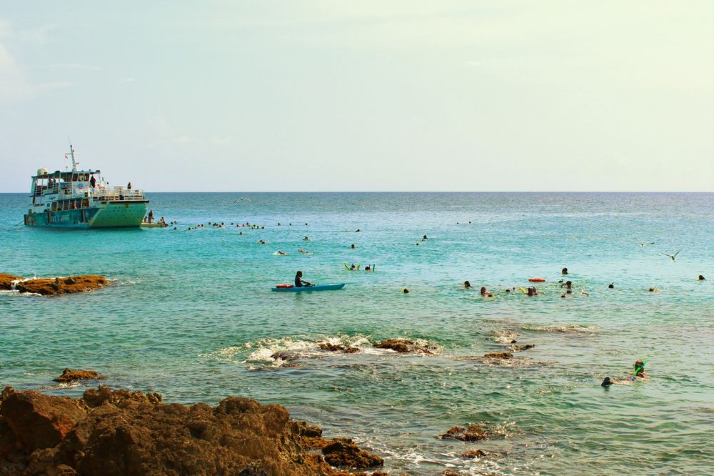 People snorkeling around Maho Beach, Sint Maarten