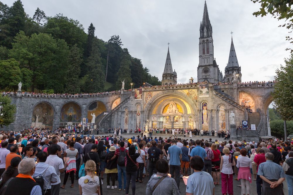 Pilgrims outside The Sanctuary Of Our Lady Of Lourdes