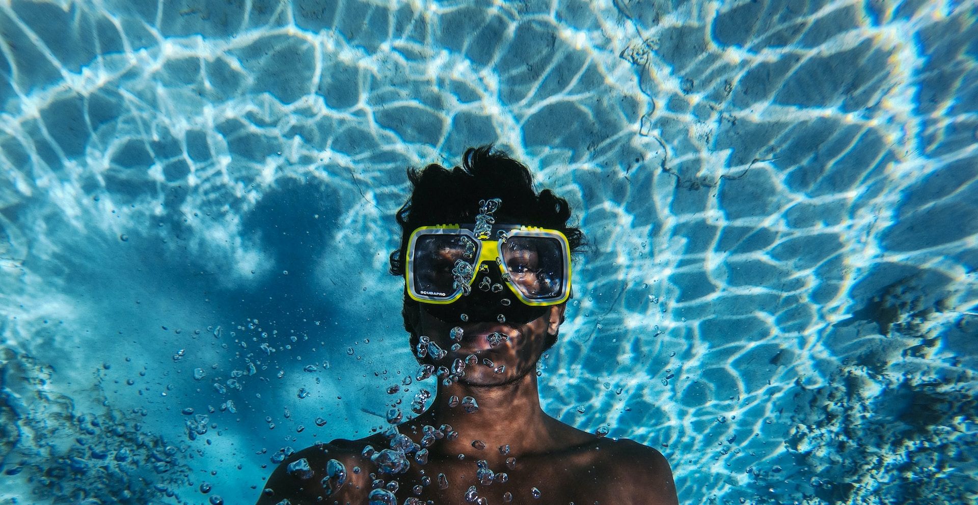 A person snorkeling in crystal clear waters