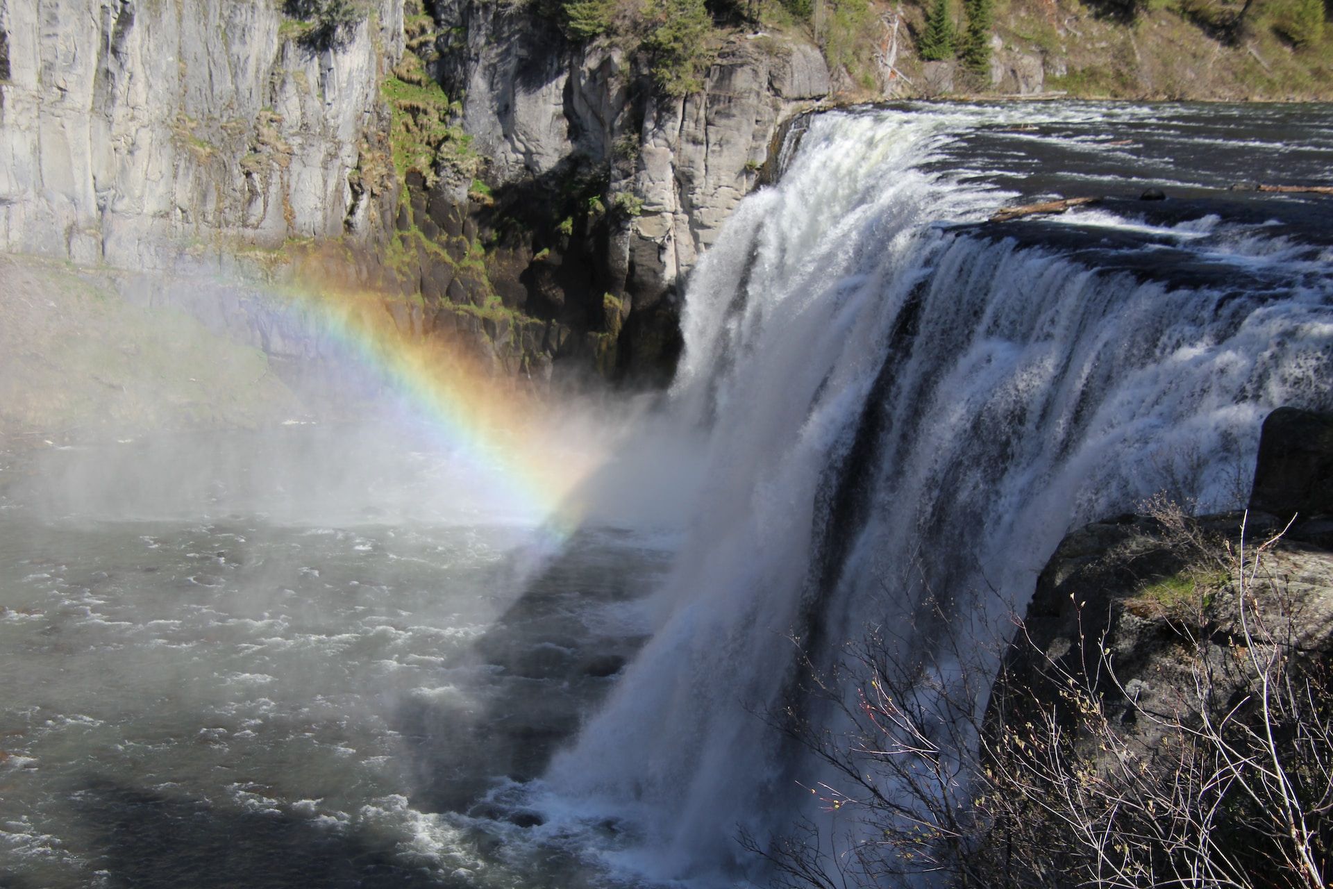 Mesa Falls waterfall with a rainbow