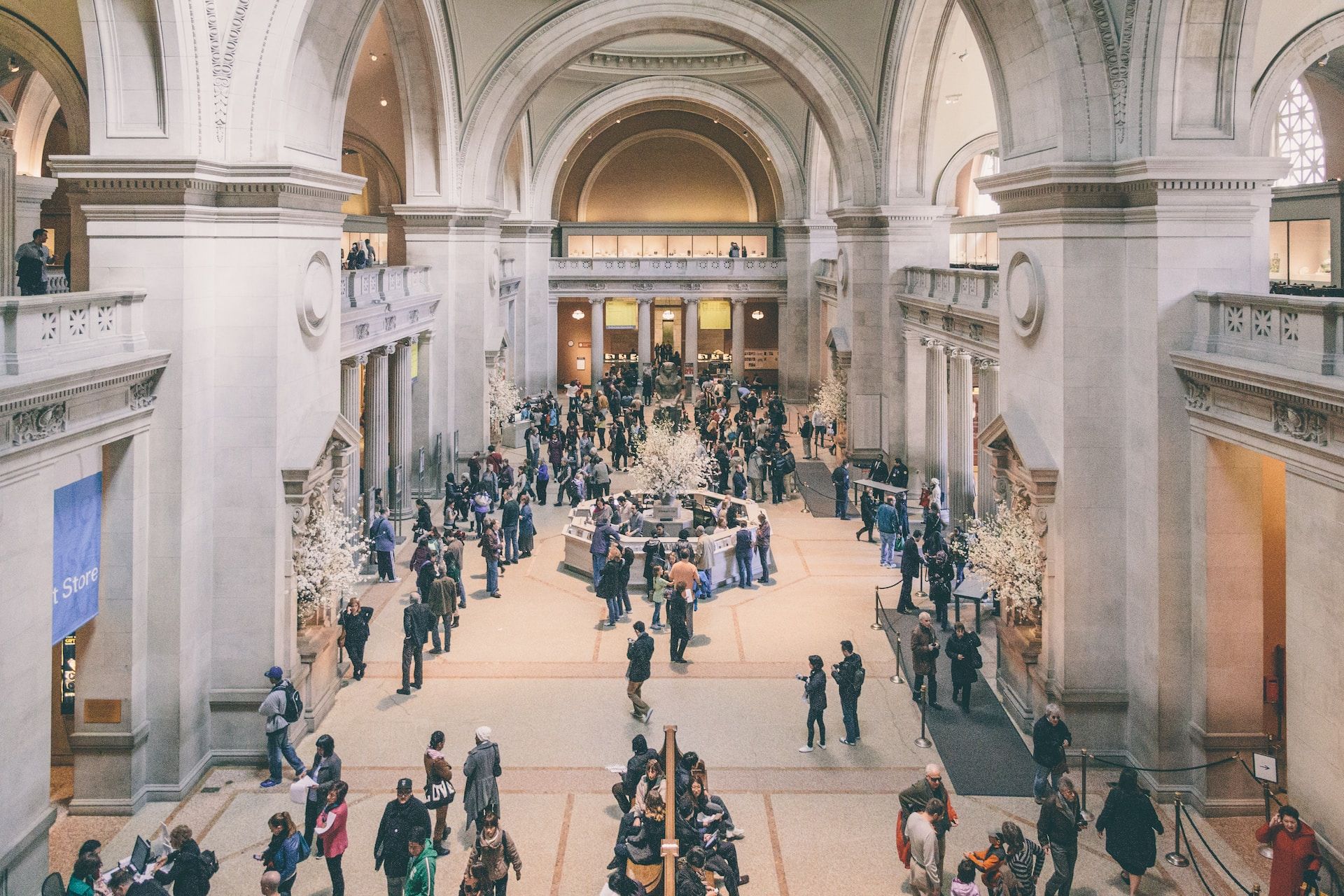 Tourists exploring exhibitions at The Metropolitan Museum of Art in New York City, USA