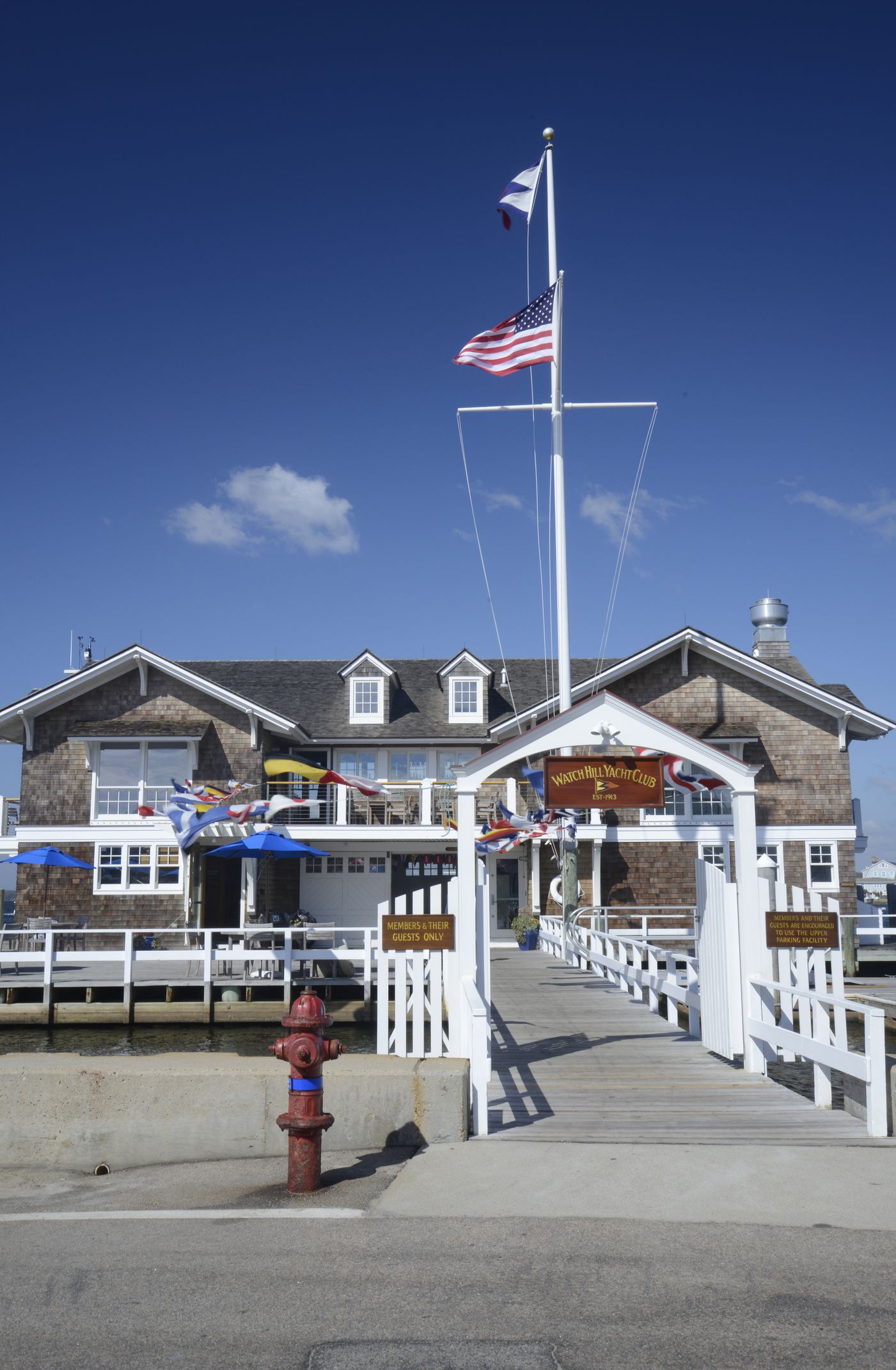 Yacht club with American flag flying in Watch Hill, Rhode Island, USA