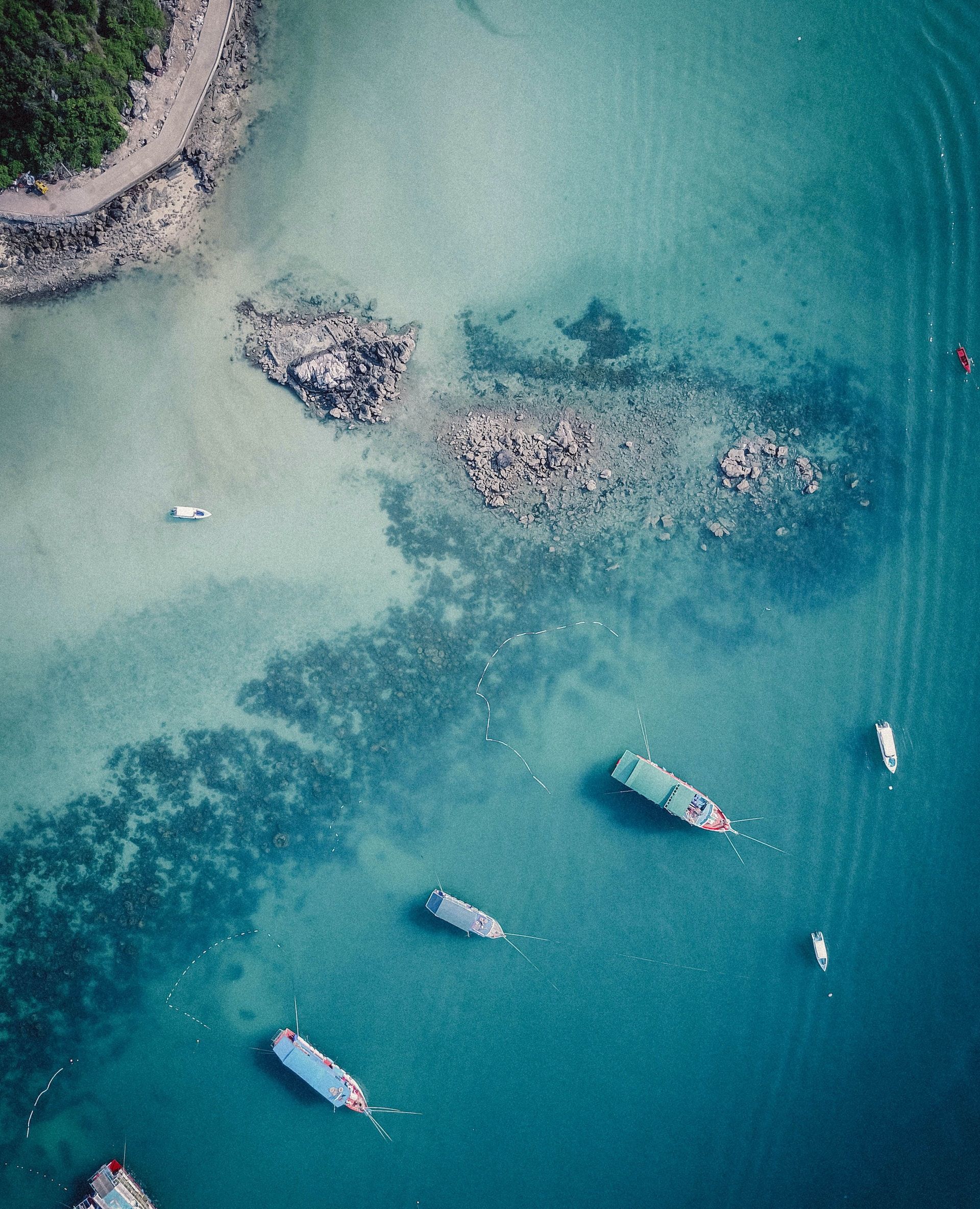 An aerial view of boats anchored off the coast of Pattaya City.