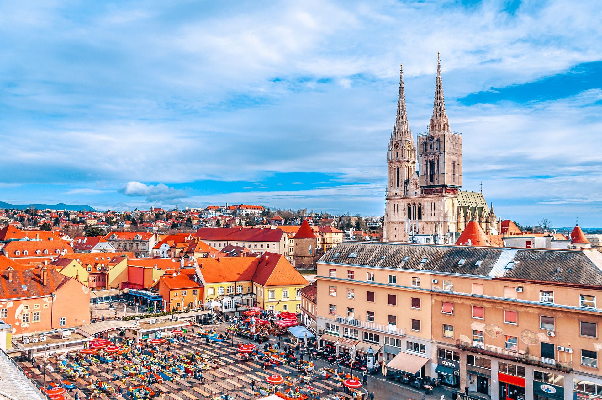 Busy City Square and houses with colorful rooftops in Zagreb, Croatia 