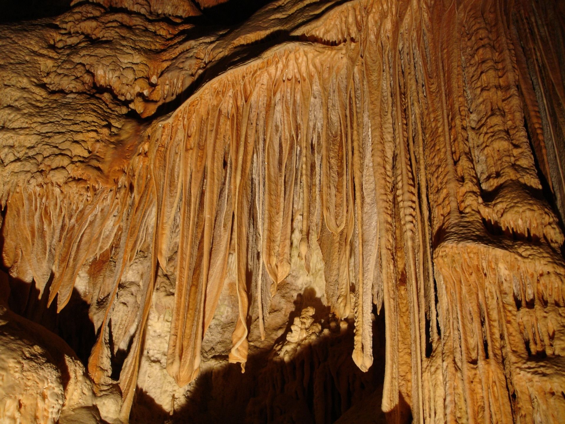 Eerie stalactite cascade in a cavern