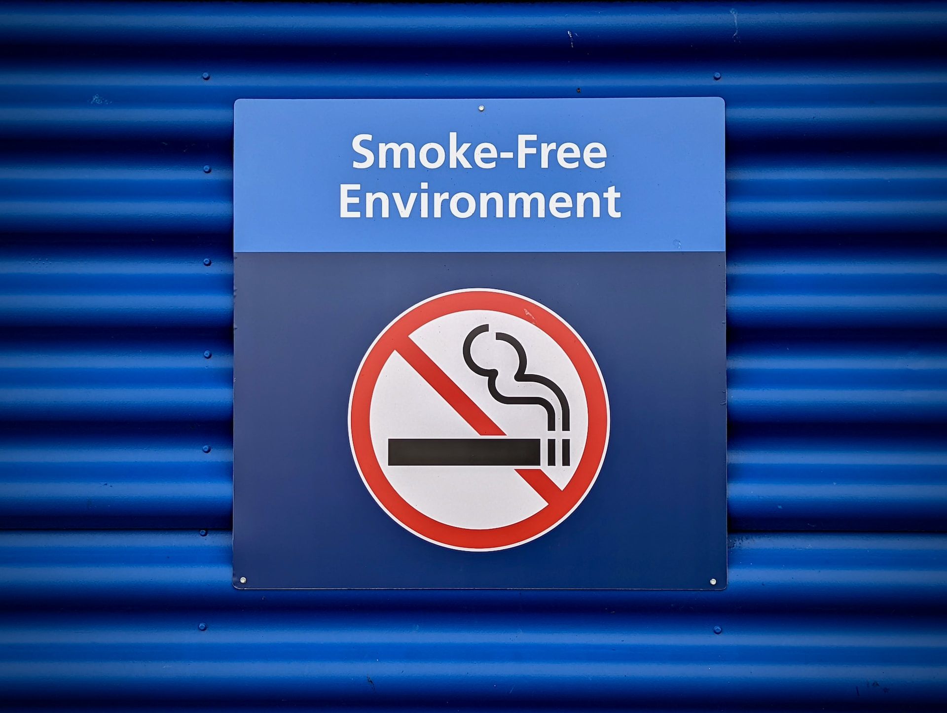 Blue Smoke-Free Environment no smoking sign 