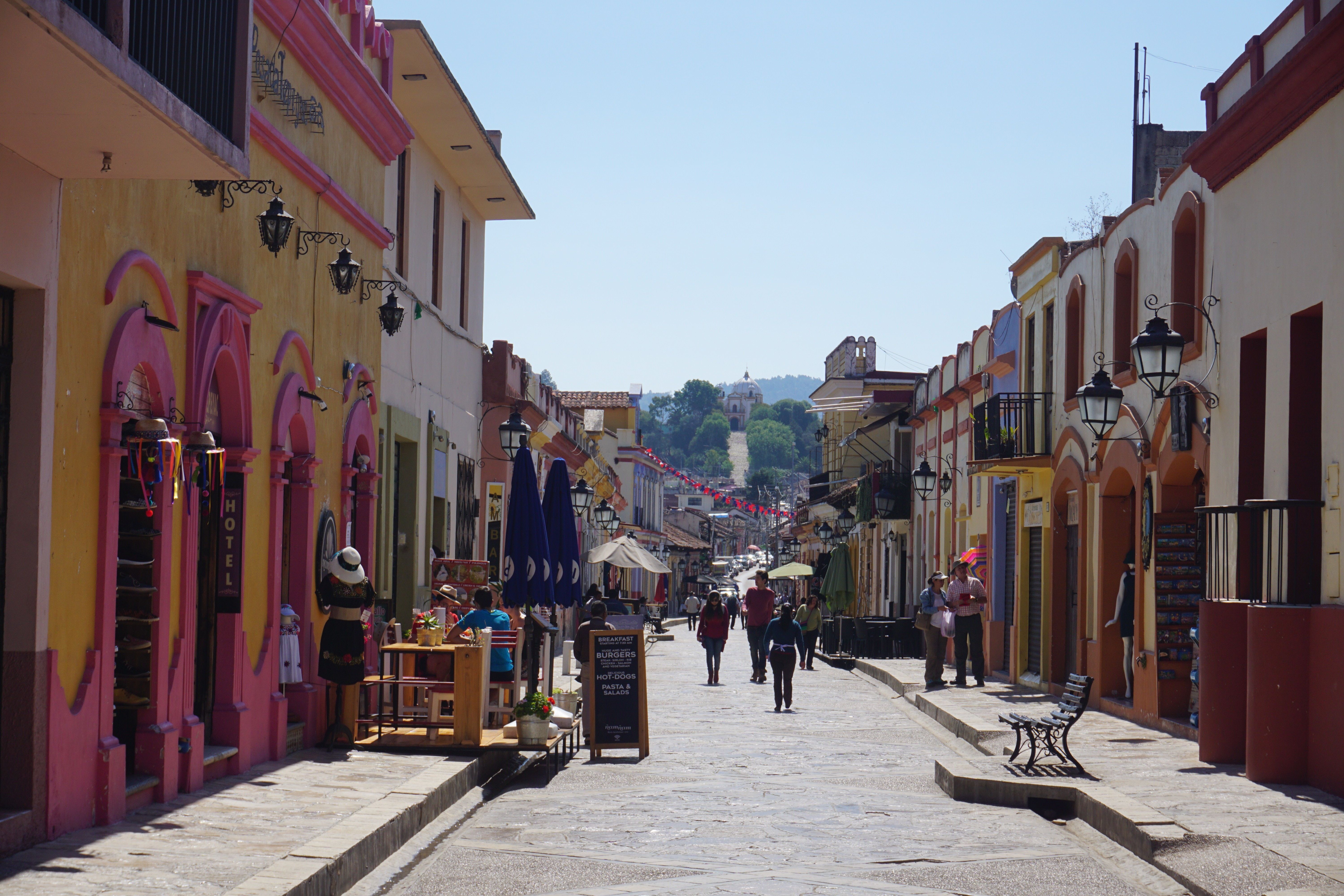 walking street with people and lined with colorful buildings in Colorful street in San Cristobal de las Casas