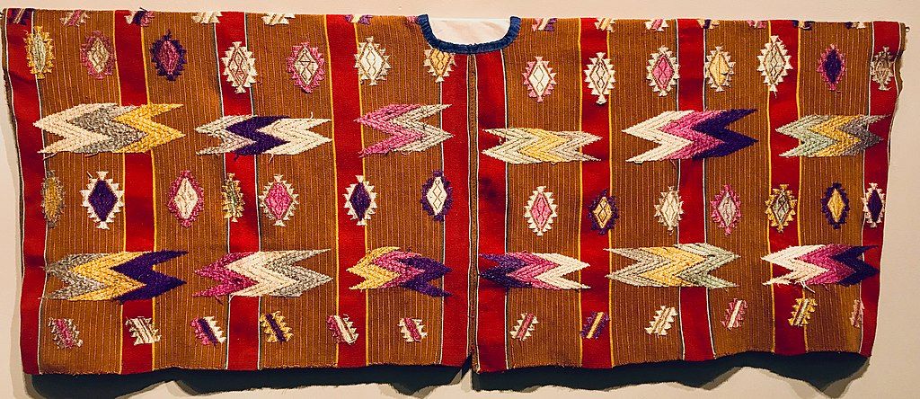 Traditional Guatemalan huipil (blouse) with naturally brown cotton and alizarin-dyed red. From the Museo Ixchel del Traje Indigena in Guatemala City.