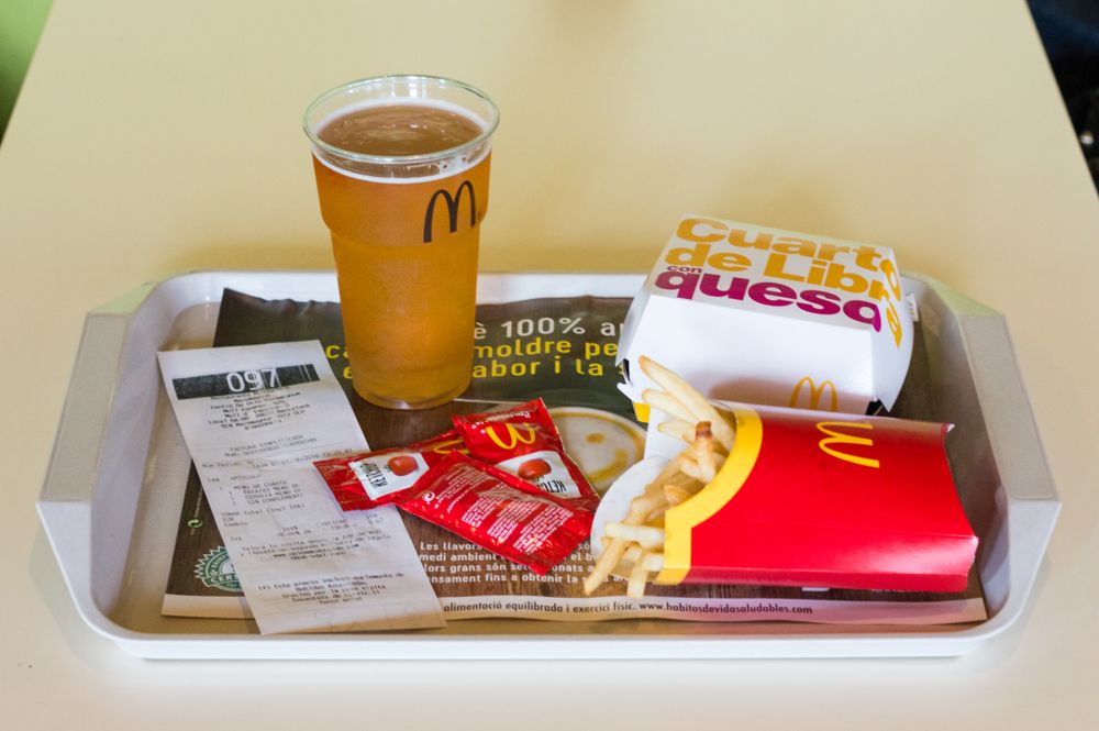 McDonald's meal with french fries and Mahou beer, Barcelona, Spain