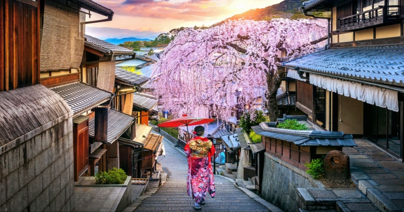 Woman wearing a Japanese traditional kimono walking at Historic Higashiyama district in spring, Kyoto, Japan