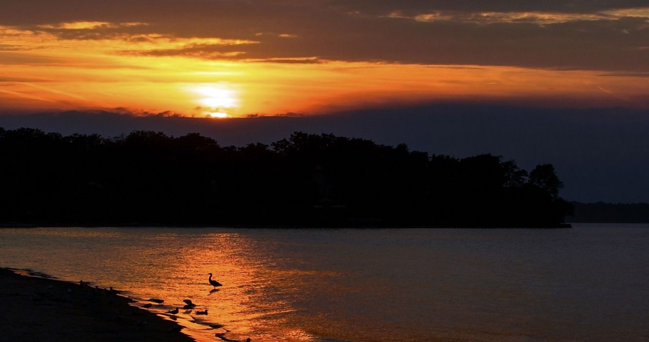 A beautiful sunset at Sodus Bay beach park in New York along the shore of Lake Ontario, USA
