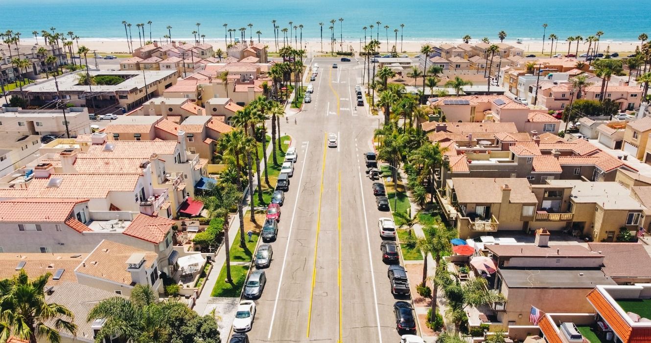 An aerial view of the town, beach, and ocean in Huntington Beach, California, USA