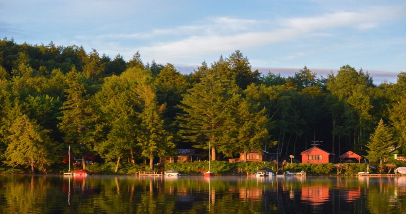 Cabins on the coastline of Saranac Lake in upstate New York, one of the most charming small towns in the Adirondacks