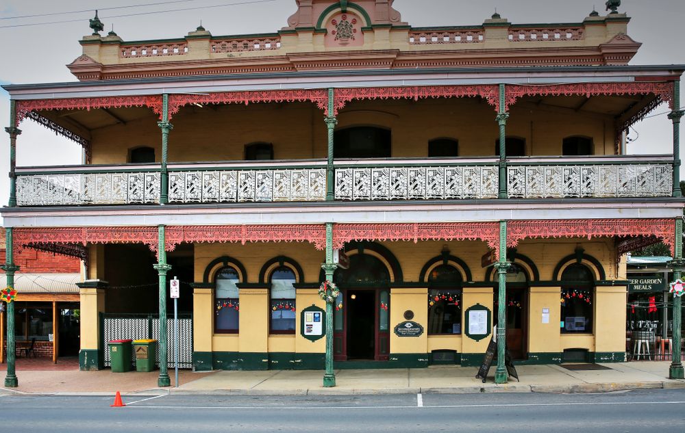 The wrought iron lacework facade of the historic Victoria Hotel in the wine growing destination of Rutherglen, Victoria, Australia