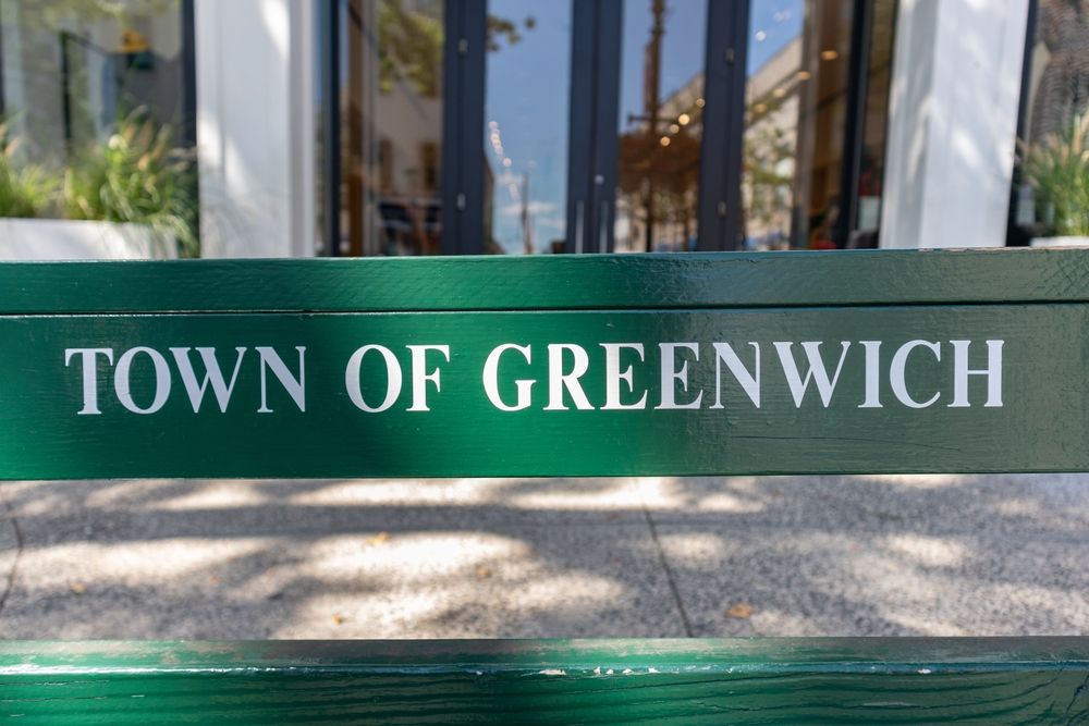 Town of Greenwich sign on a Bench on Greenwich Avenue in Downtown Greenwich, Connecticut