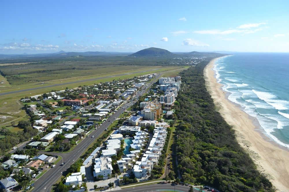 Aerial view north along Marcoola and the beach towards Mount Coolum, Sunshine Coast, Australia