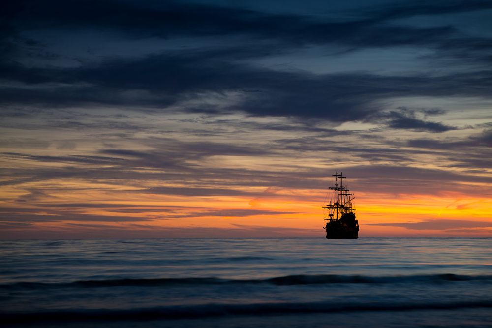 Pirate ship on sunset