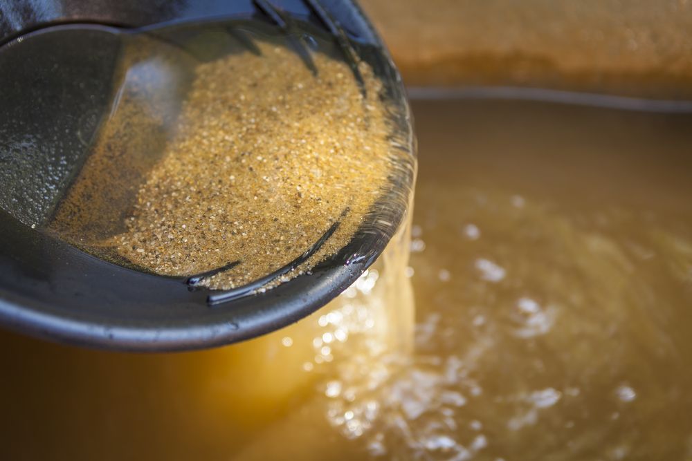 Close up of gold panning pan with sifting sand