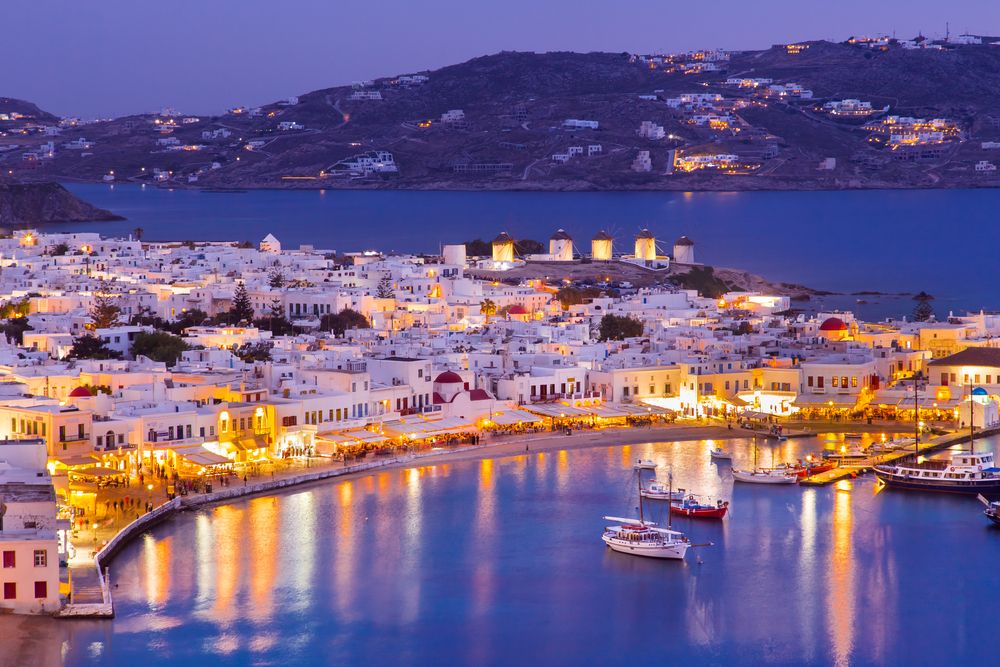 Mykonos port with boats at night