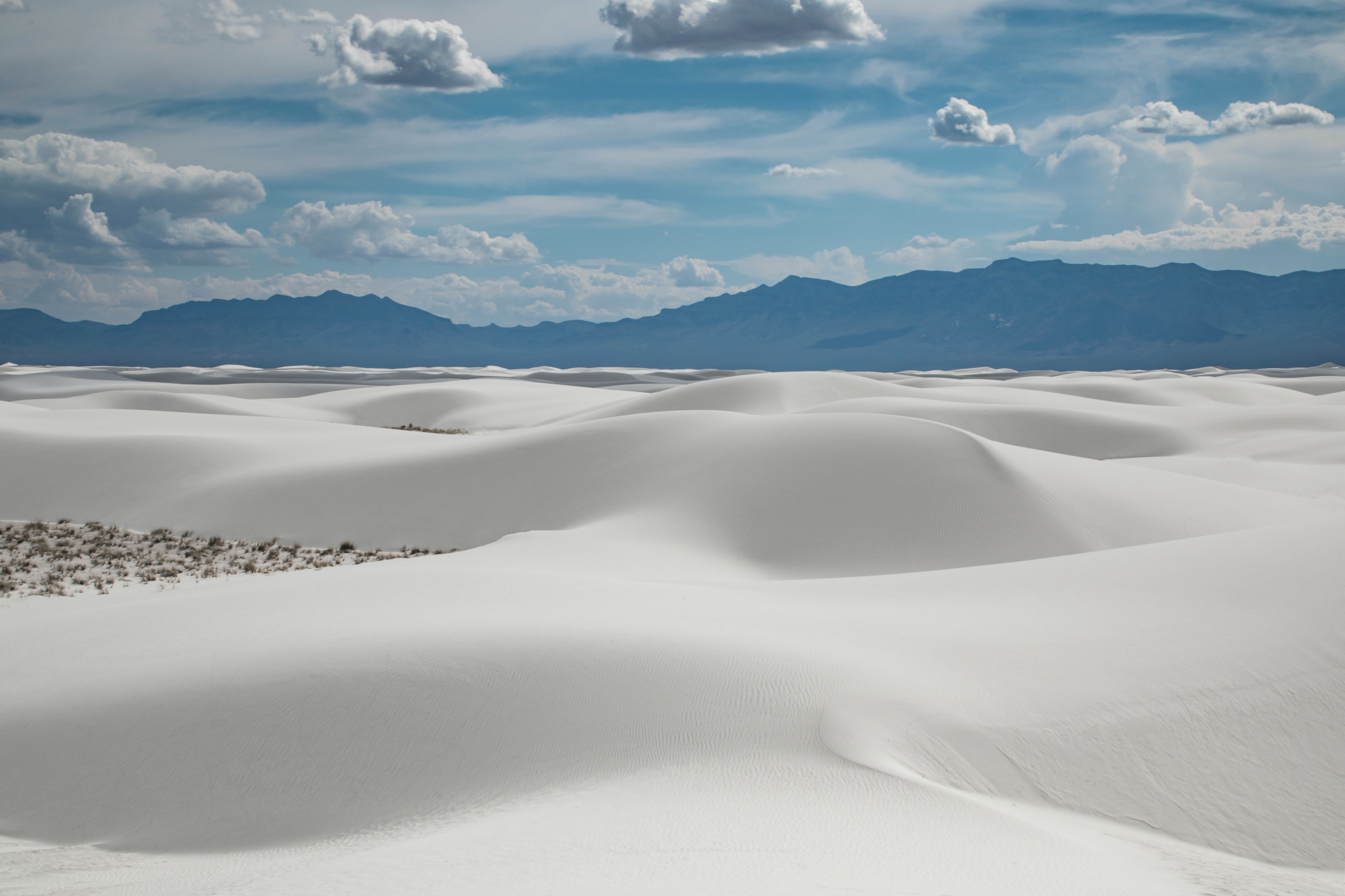 White sand dunes of Lencois Maranhenses National Park in Brazil under a cloudy sky