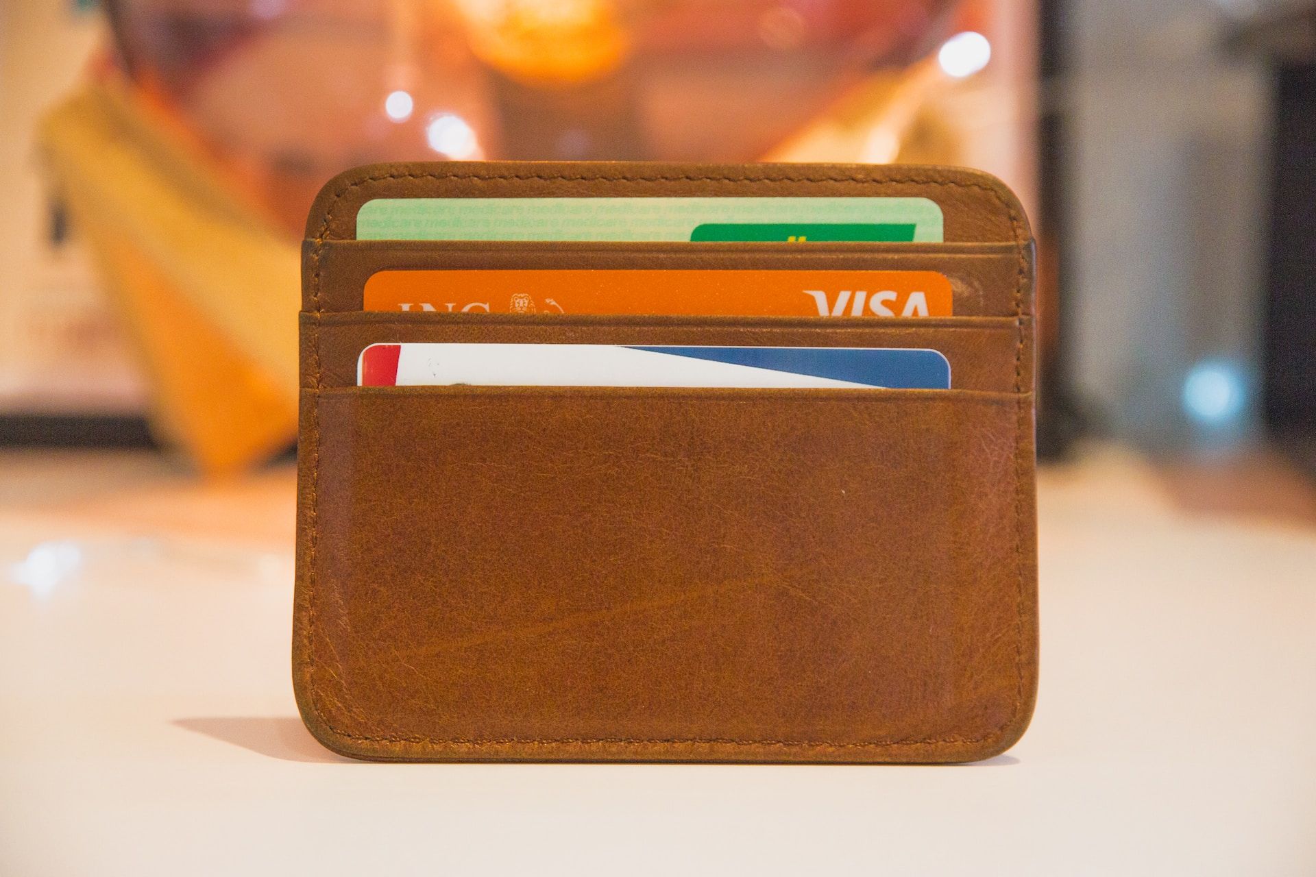 Three credit cards in leather credit card holder 