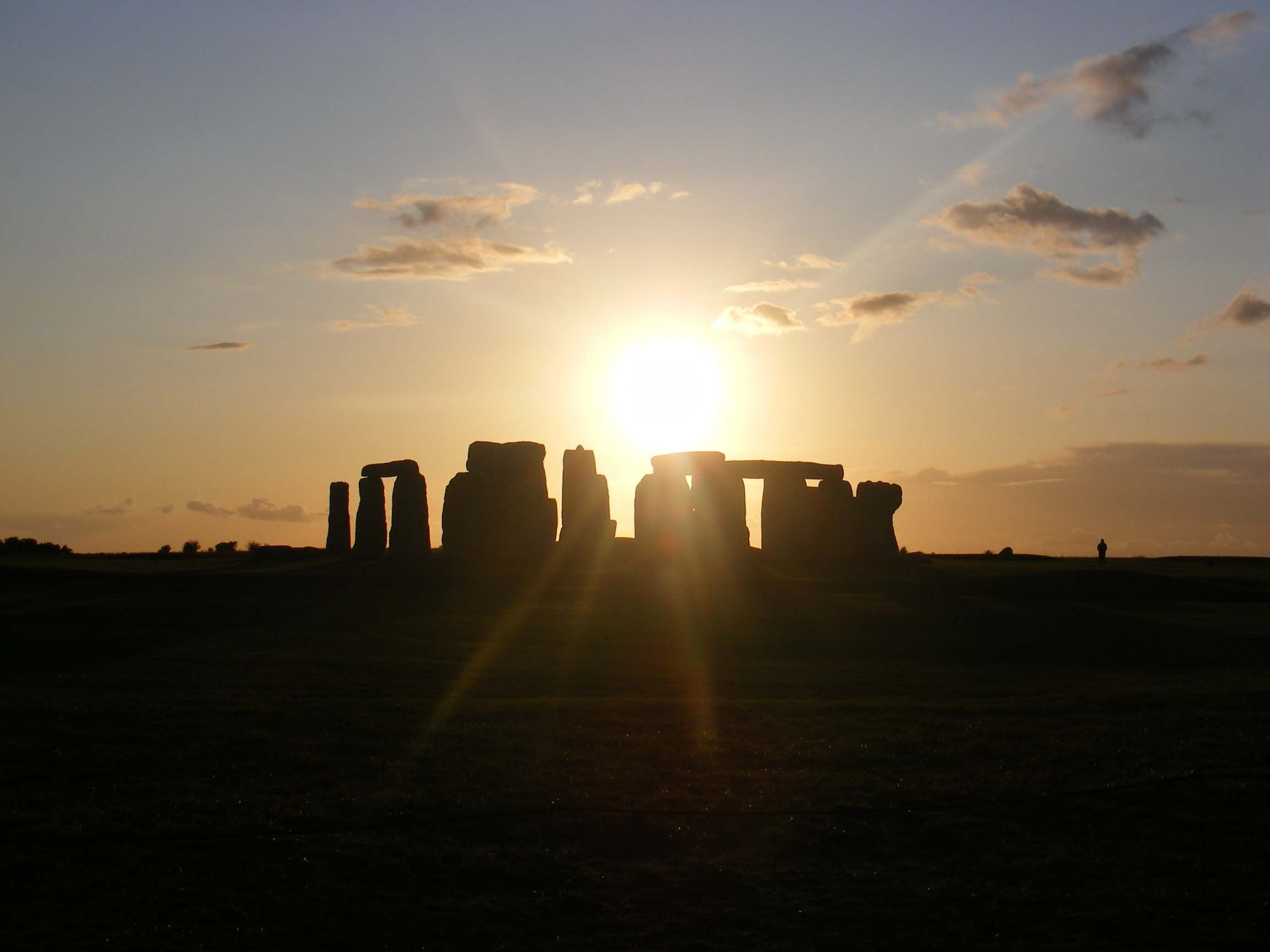 Sun rising behind Stonehenge in England