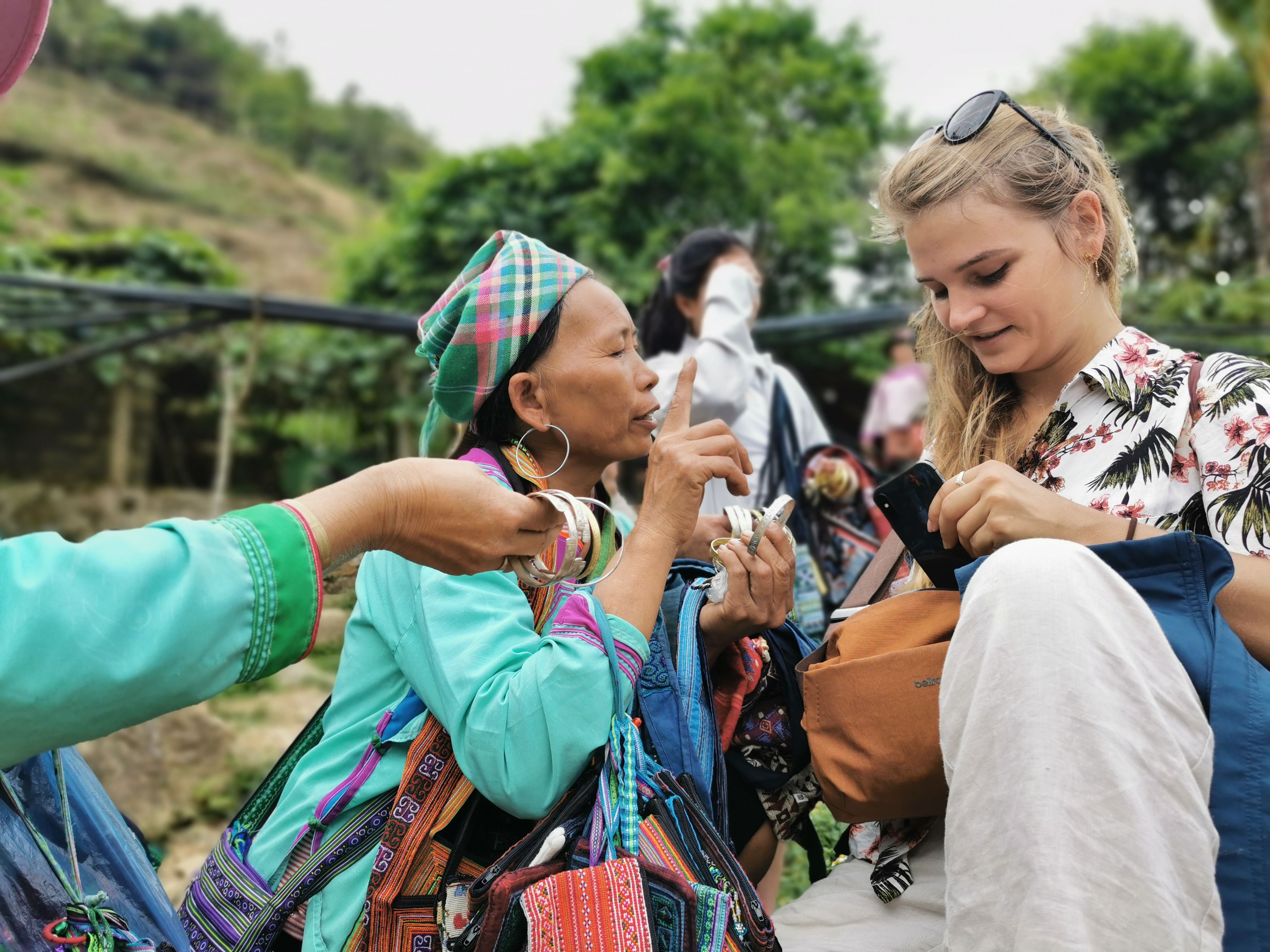 Tourist Haggling For Traditional Wares In Sapa, Vietnam