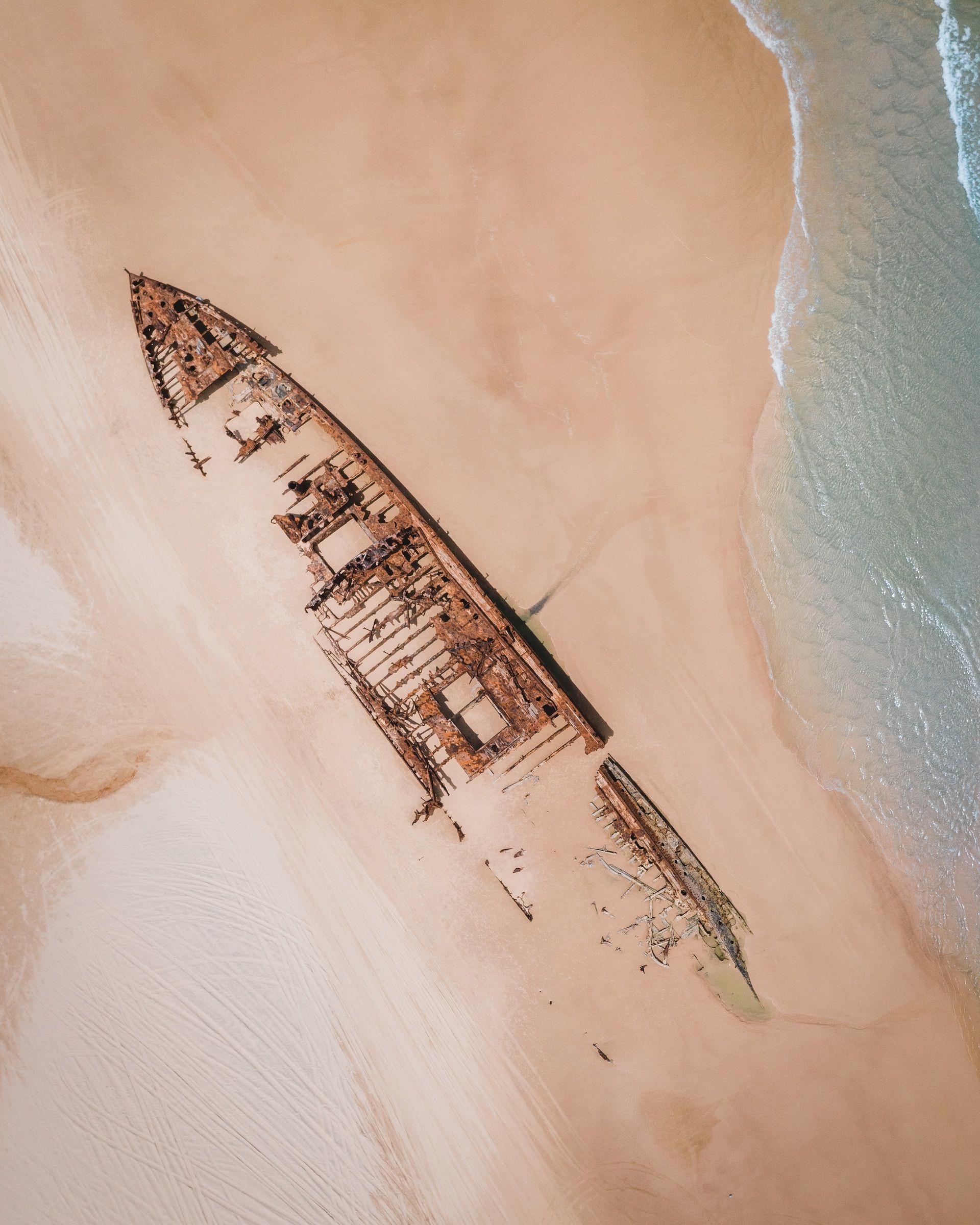 Aerial view of Maheno Shipwreck on 75-Mile Beach in Fraser Island, Australia