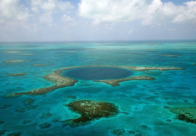 Aerial view of The Great Blue Hole featuring blue water 