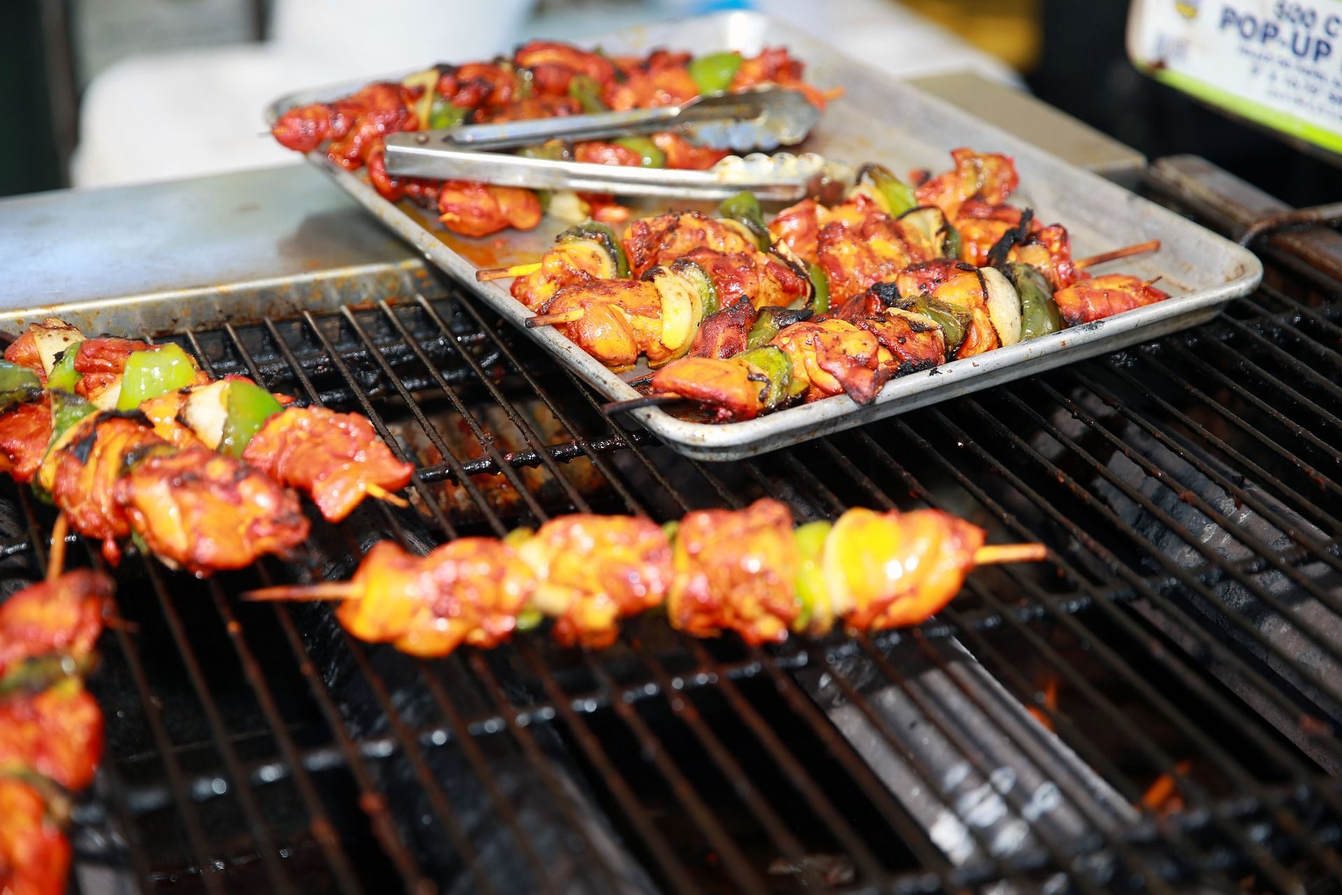 Skewers on a grill representing delicious Caribbean cuisine