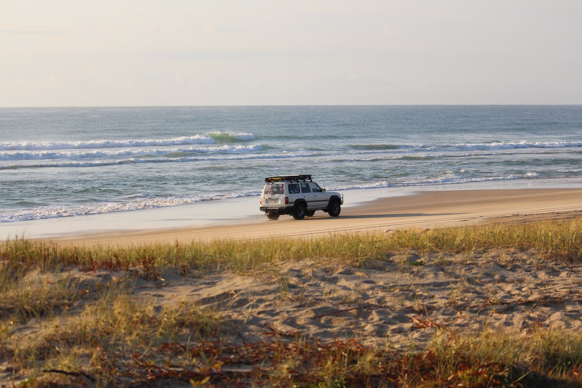 Car driving on sand in Fraser Island Australia