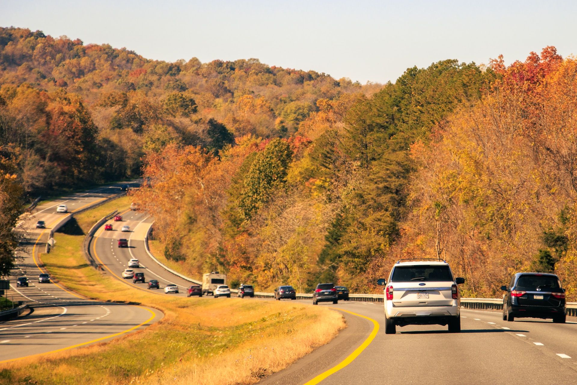 Cars on a highway with trees on both sides in Virginia