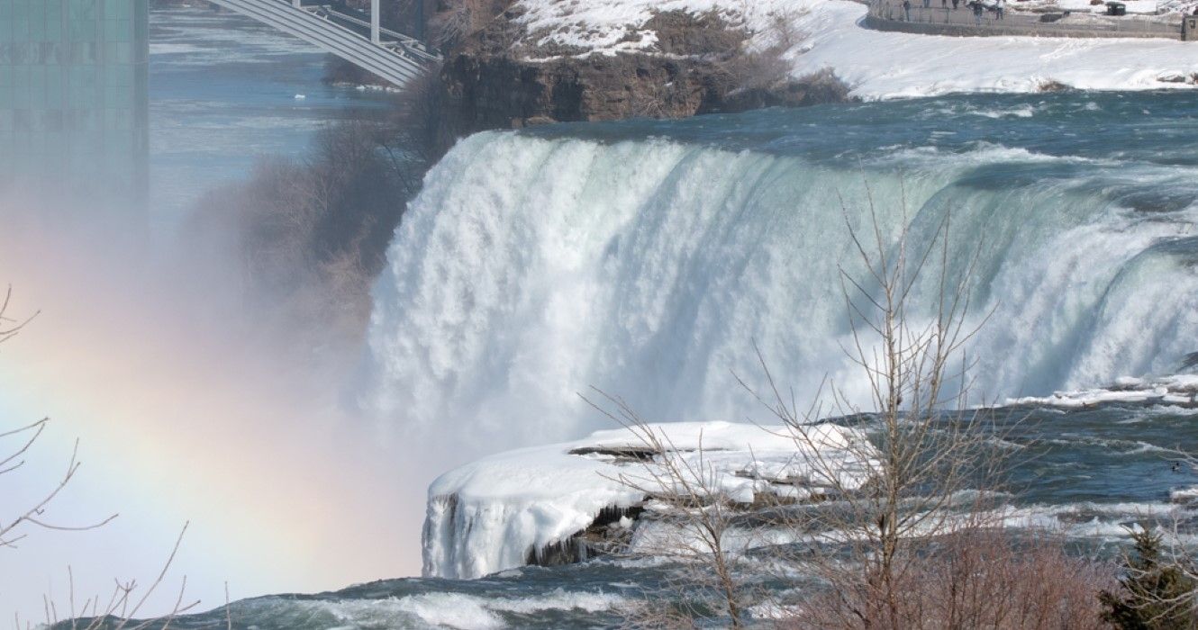 Ice-covered Niagara Falls with Rainbow and Three Sisters Islands at Niagara Falls State Park