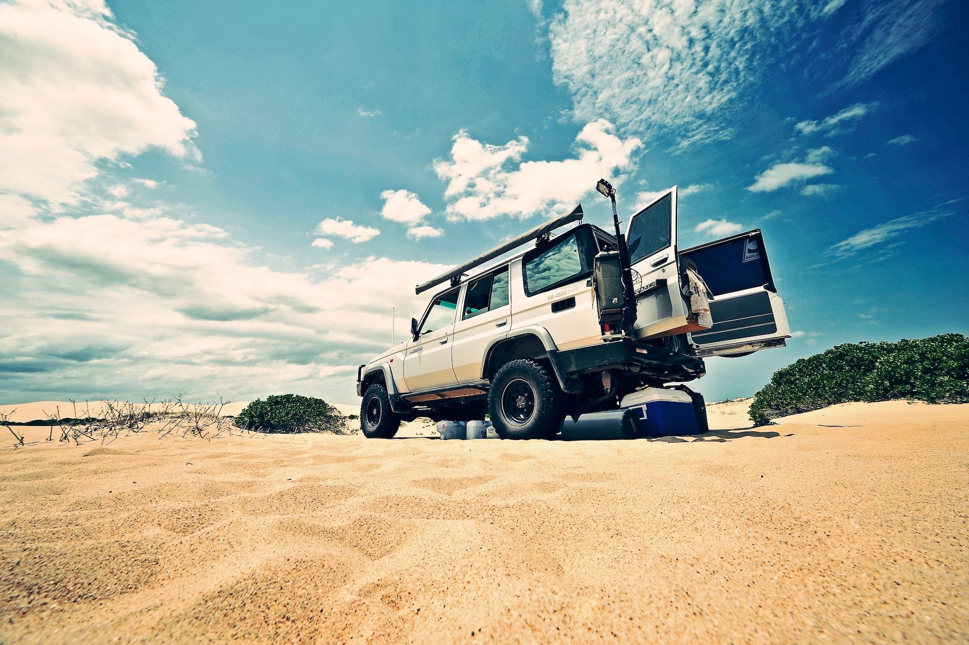 A Land Cruiser getting loaded up with supplies on the beach in Australia