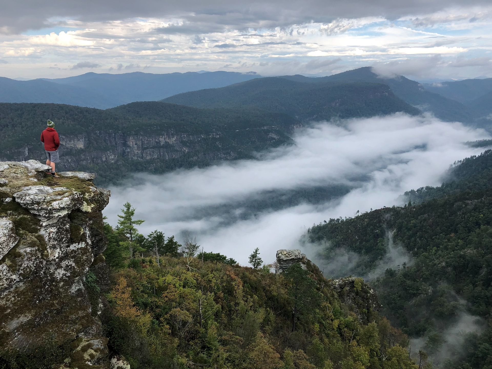 A hiker looks over Linville Gorge in North Carolina 